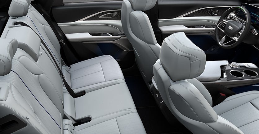 Cadillac Lyriq with lake view sunrise in background